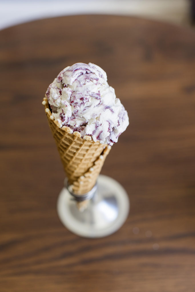 Ice Cream and Cone in focus on a stand